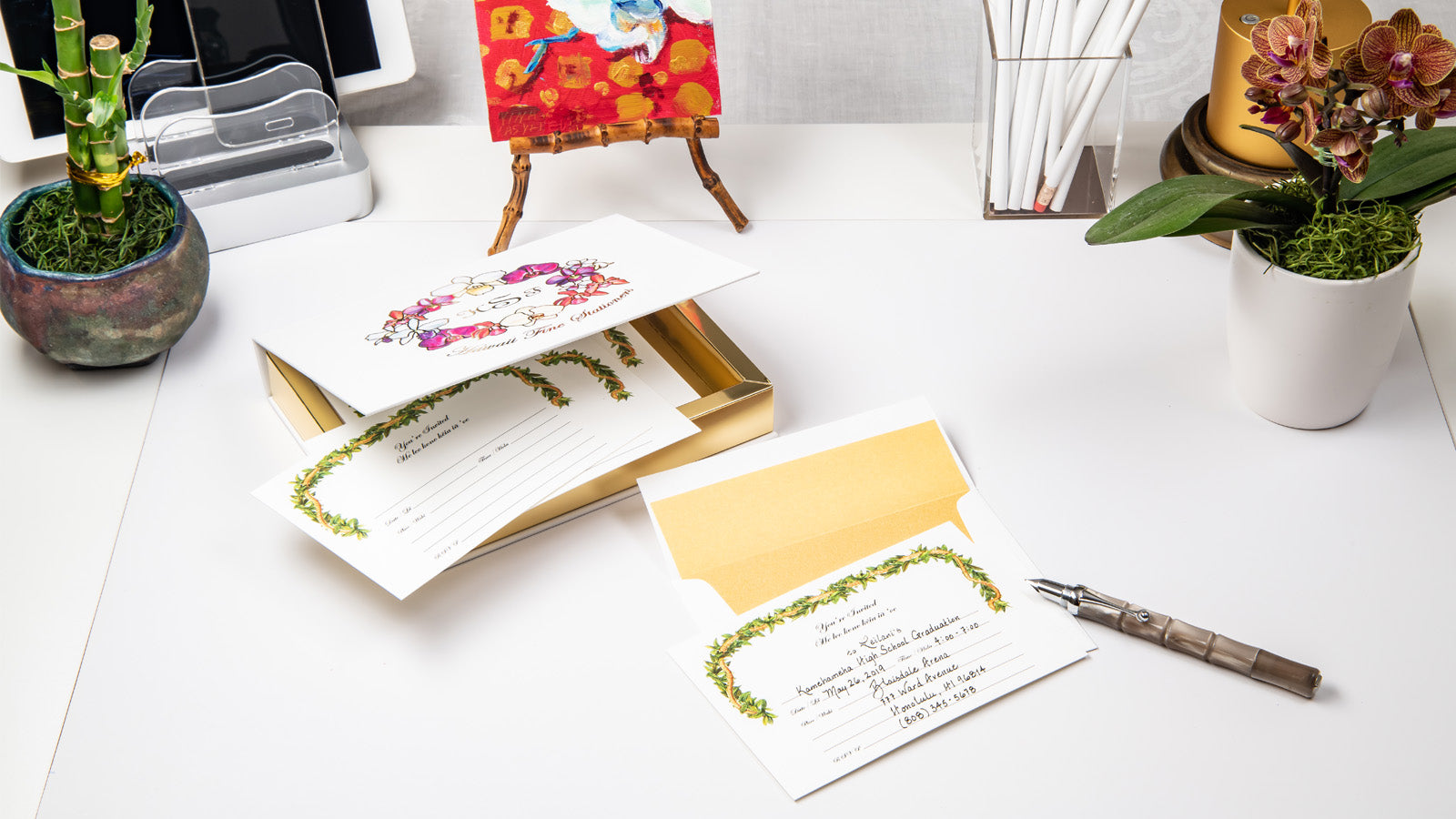 Hawaii Fine Stationers fill-in invitation with box shown on desk